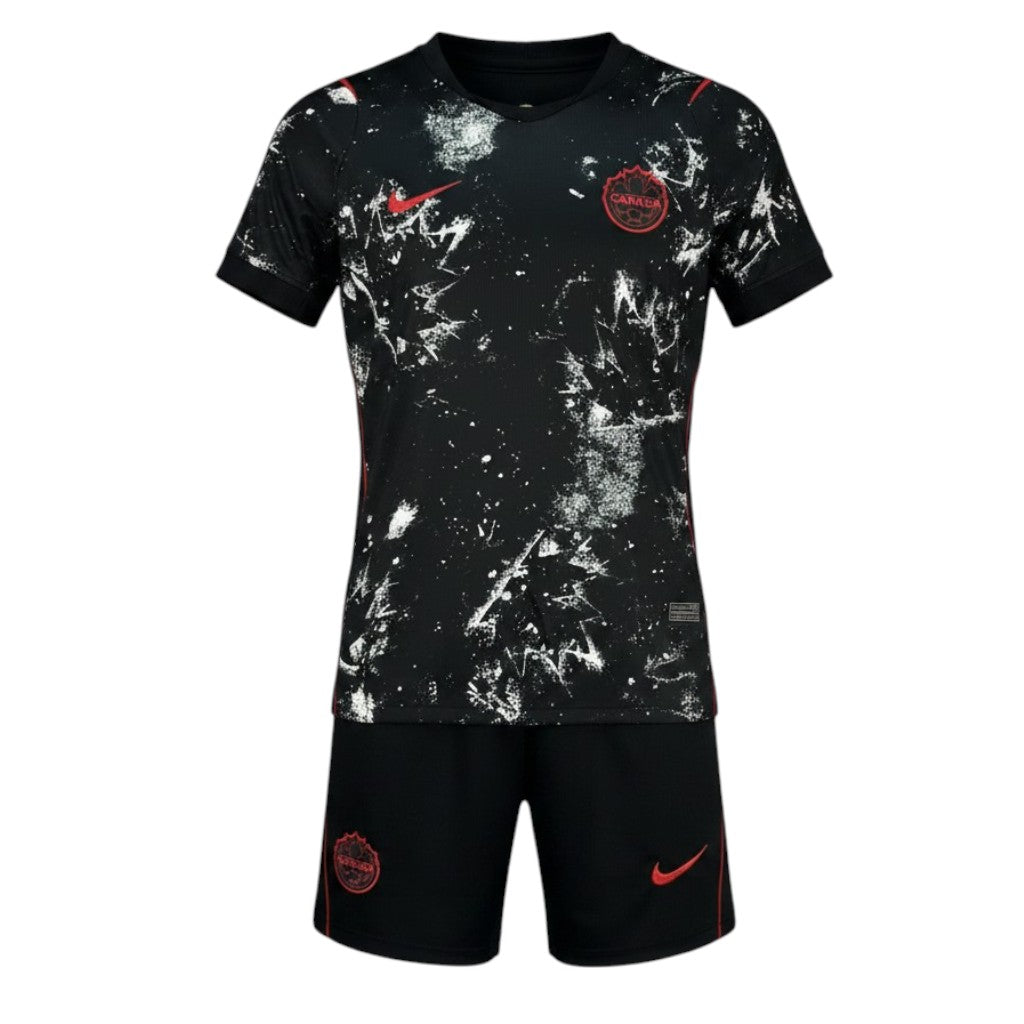 Kit criança Velukz Canadá Alternativa 2026, uniforme com detalhes vermelhos e azul, para crianças, em imagem com fundo branco.