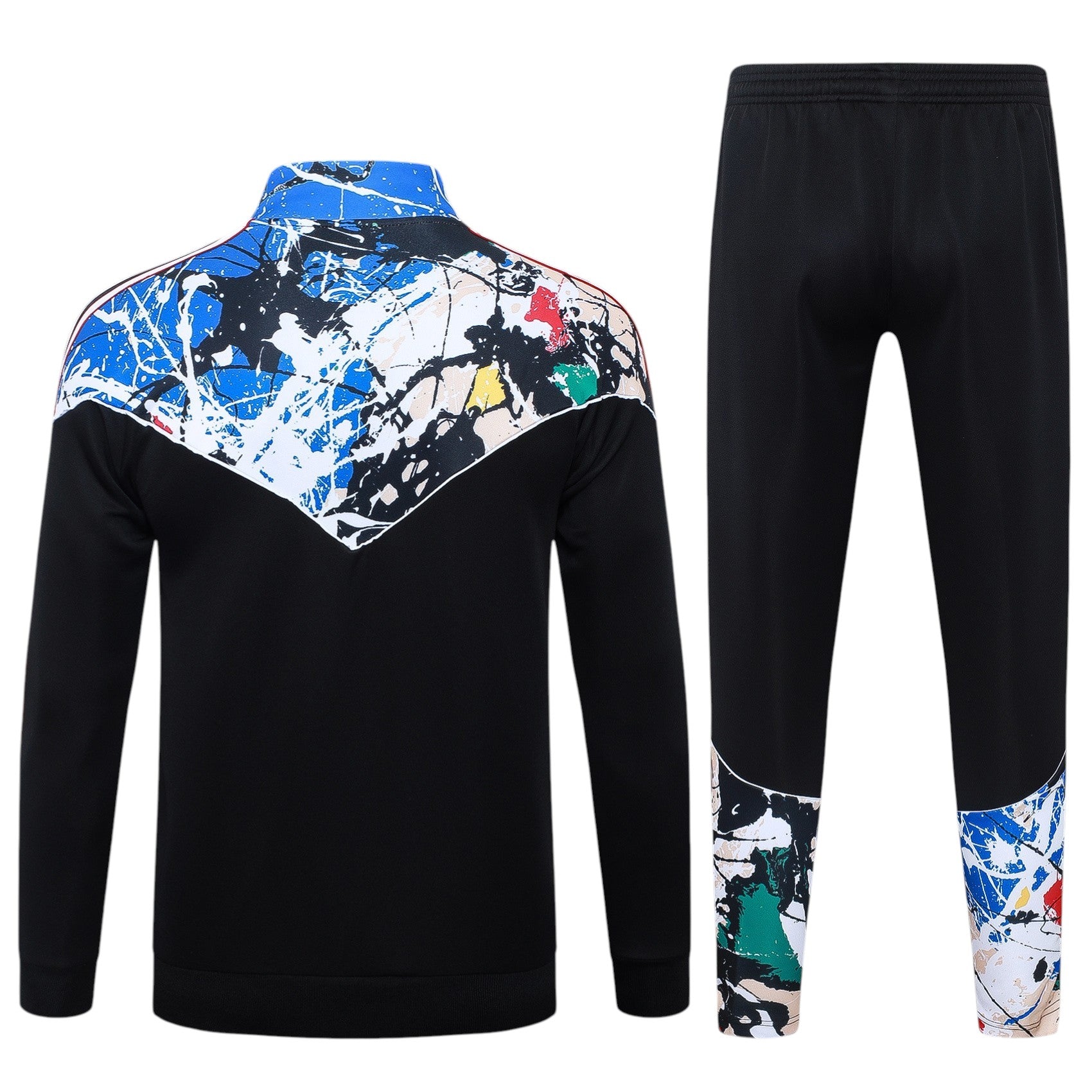 Conjunto de treino Manchester United Velukz 26/27, com camisola e calças, em cores vermelha e branca, em tecido confortável.