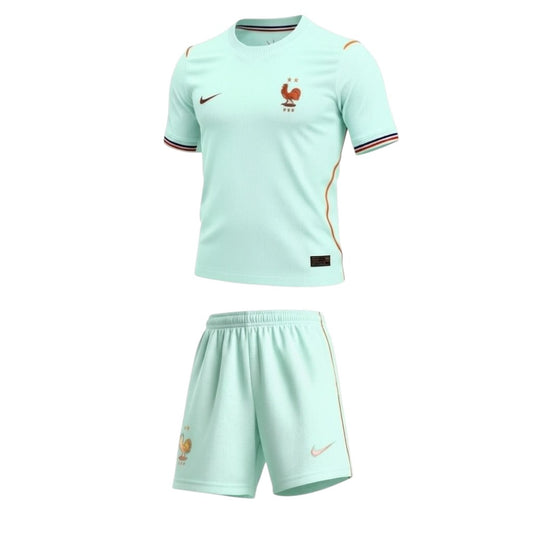 Kit criança Velukz França 2026, uniforme com detalhes da seleção, ideal para fãs jovens, em cores azul, branco e vermelho.