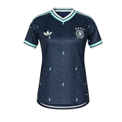 T-Shirt Alternativa Mulher Alemanha 2026 da Velukz, azul com estampa do símbolo da seleção alemã, vista frontal.